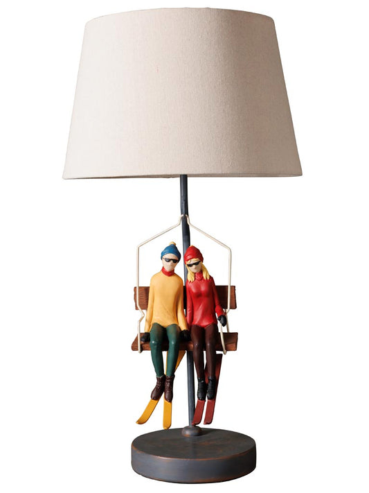 Lampada da tavolo con seggiovia