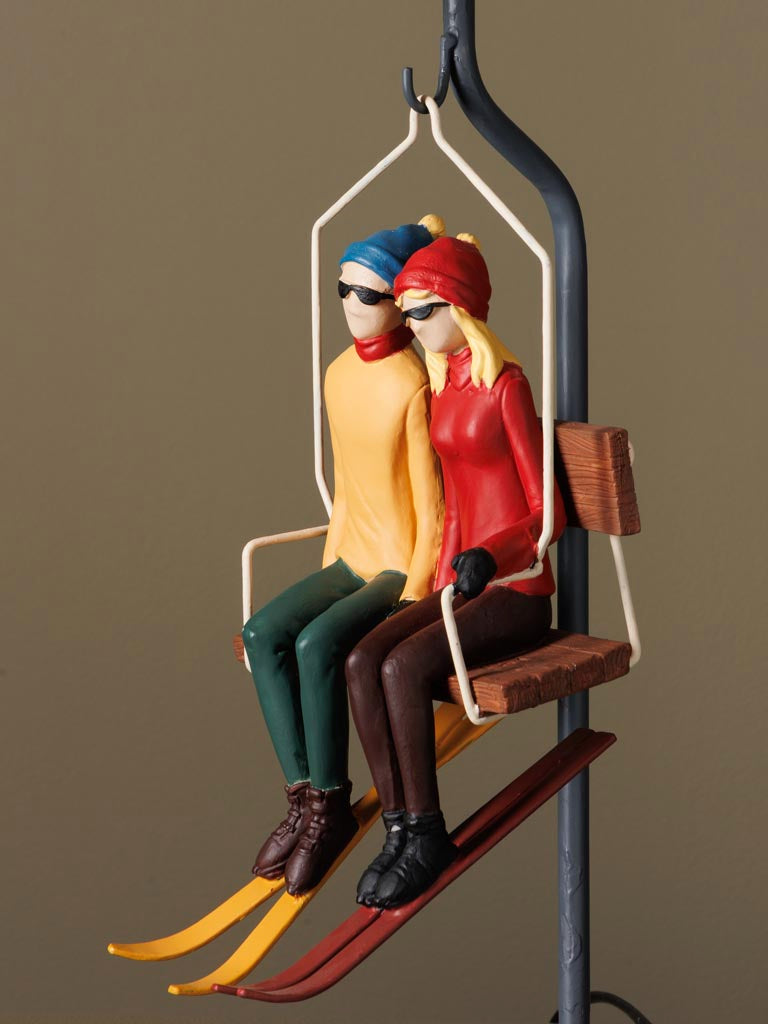 Lampada da tavolo con seggiovia